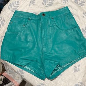 Turquoise leather mini shorts